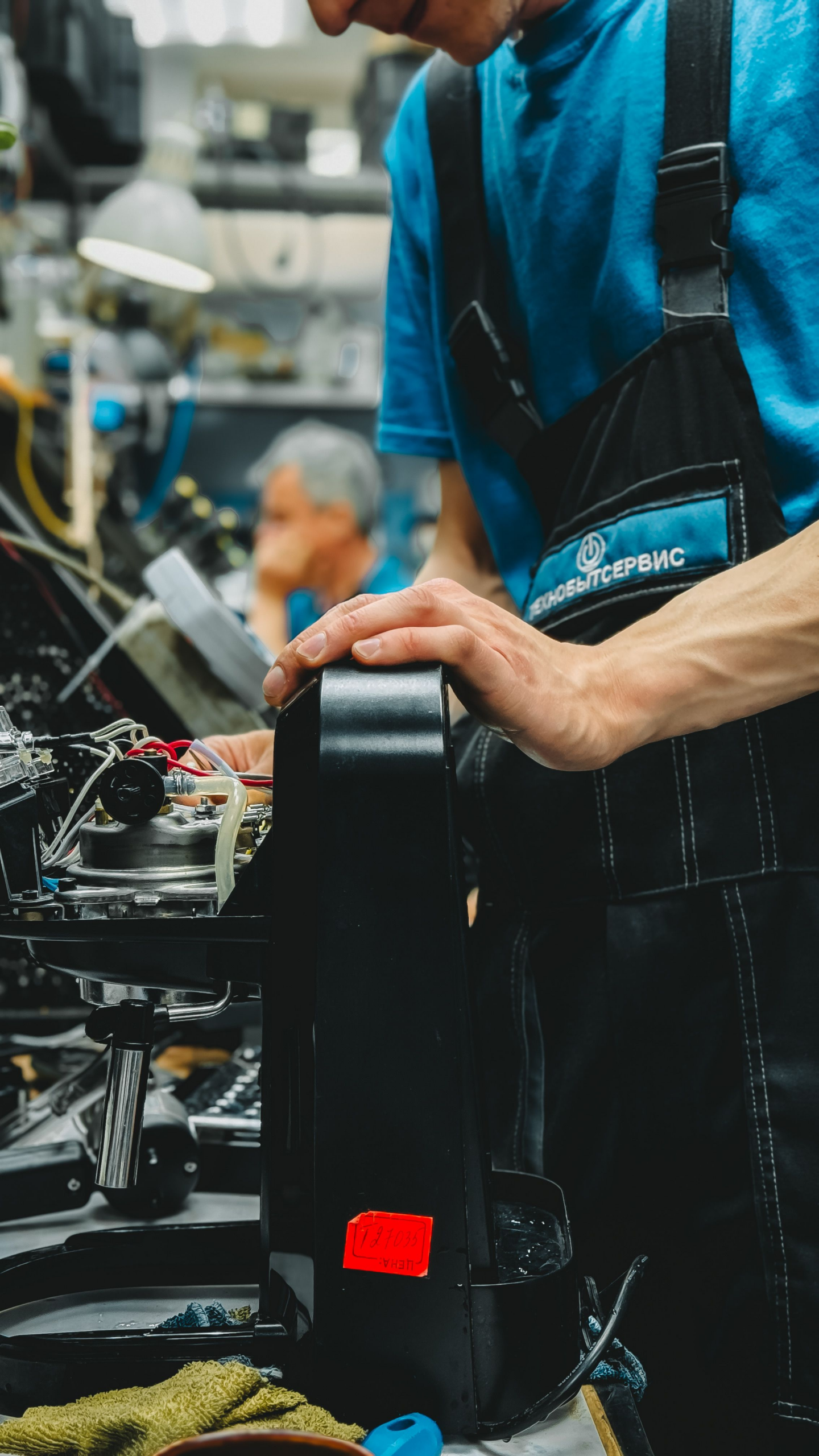 Technician working on an appliance related to maytag washer error codes in Conyers, GA